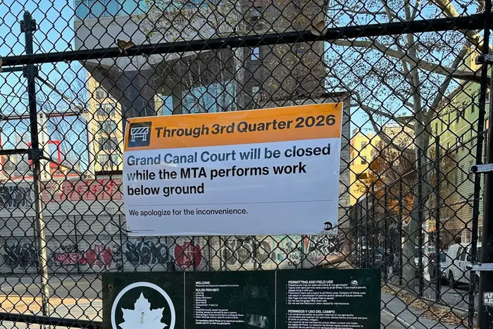 A MTA sign on a basketball court indicating the courts will be closed until the third quarter of 2026.